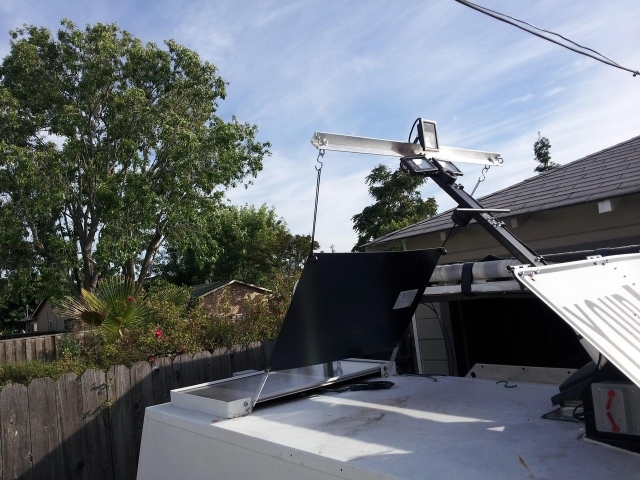 trailer showing actuator holding flexible solar panel