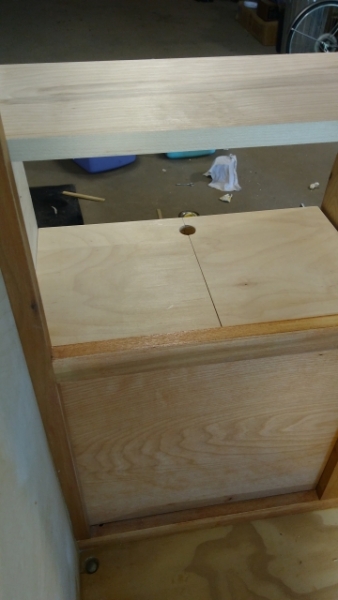 Bottom shelf with access to storage