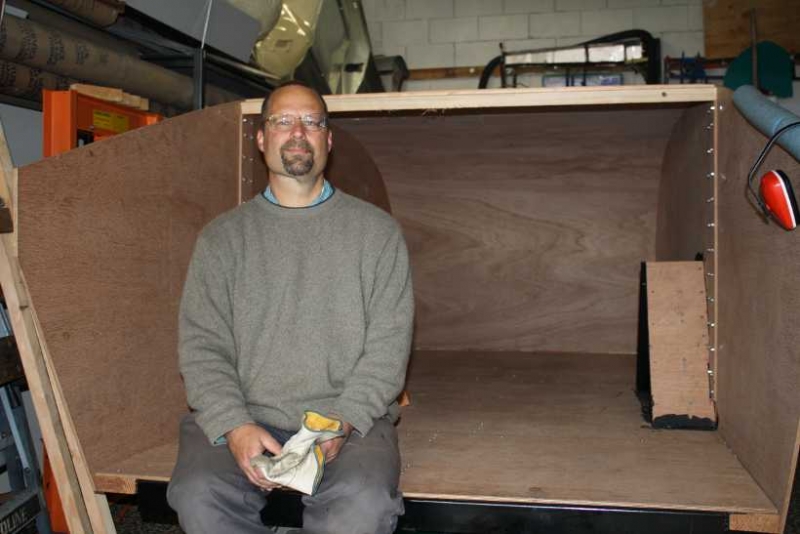 Mark sitting in trailer. Main head liner completed. 05/15/2010