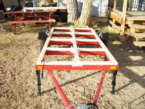 (0149) This is the finished wooden frame. I notched out where it will interfere with the bolts on top of the HF frame. This way it will sit flush on the trailer frame.