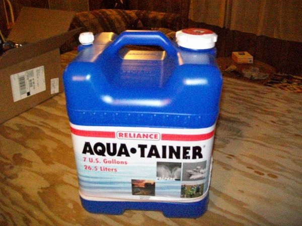(0268) I decided not to install a water tank. I will just use one or two of these 7 Gallon containers from Wal-Mart.