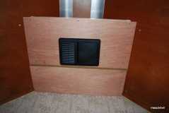 Front cabinet panelling with converter cover on