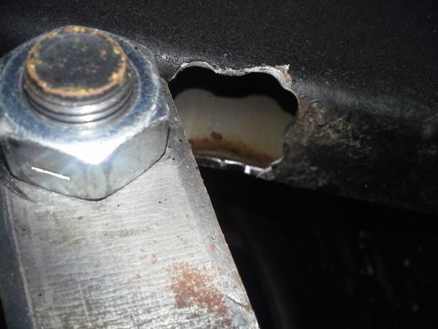 broken away, hole left in frame