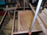 Installing the underfloor storage box.