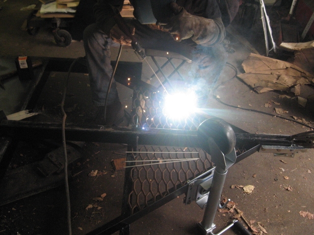 Buddy Mike welding in the gratework.
