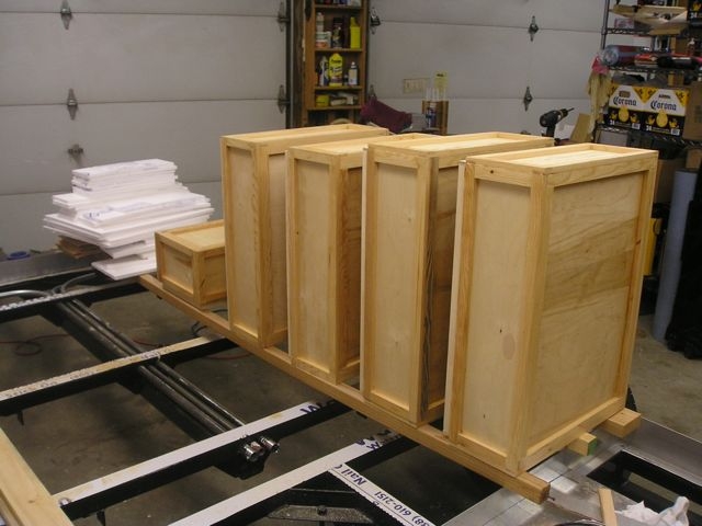 Below floor storage boxes farmed to accept 1/2" insulation