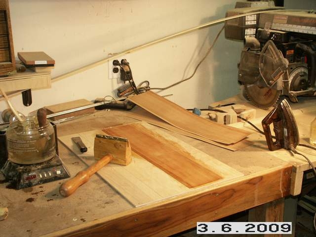 Veneering cabinet panels
