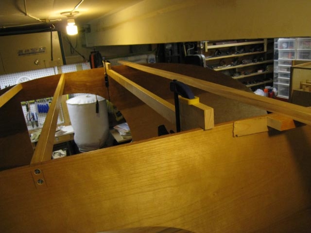 Used clamps and scraps to line up spars to marks before attaching with screws