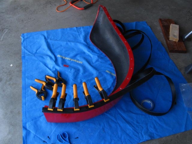 Cut notches in the welting so it would follow the curves of the fender without bunching
