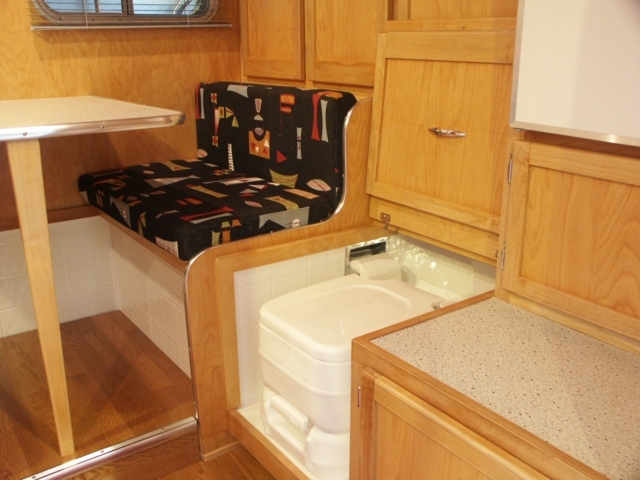 Porta-pottie storage with cover open