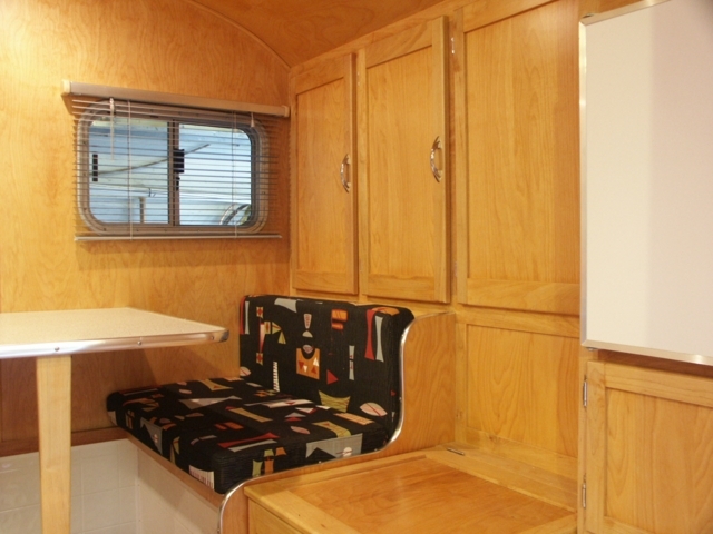 Dinette, front storage and icebox. now it has a shore power fridge