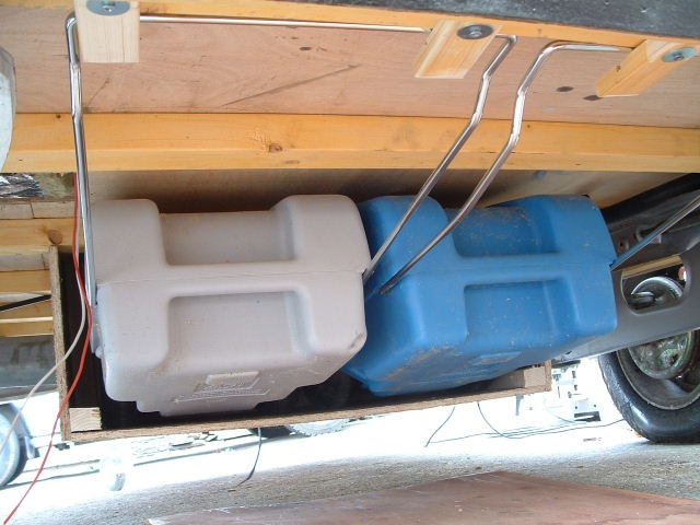 Water containers stored under the trailer