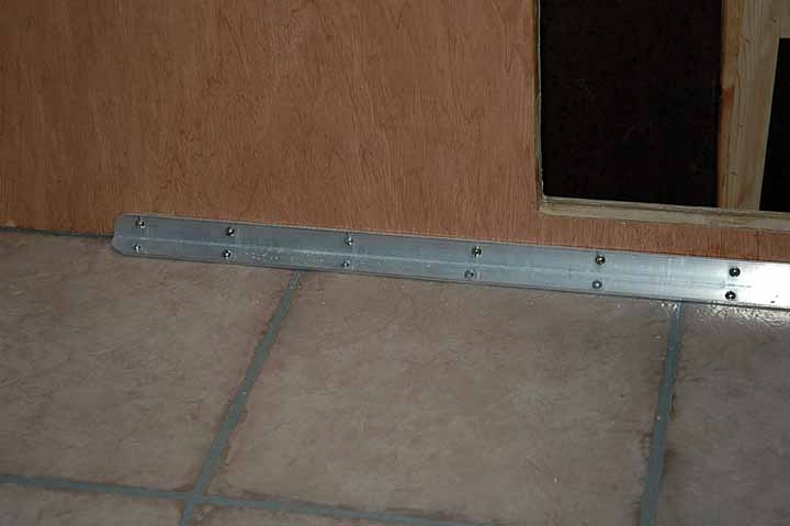 Aluminum angle helps support the walls