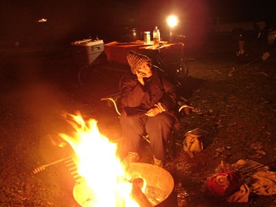 My wife sitting by the fire at Hueston Woods Halloween celebration
