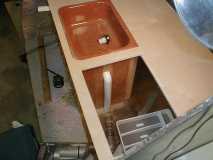 Fitting the drain bewteen the sink and the ice box