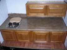 upper cabinet installed,sink in beadboard calked