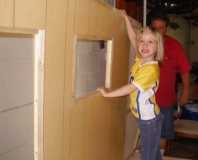 Daughter helps hold the wall