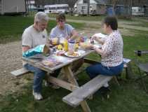Bob, Lorna and Diana eating dinner