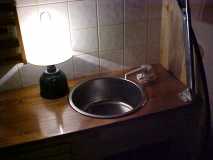 Galley with lamp and faucet.