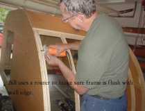 Bill uses router to make sure hatch frame is lined up with side wall.