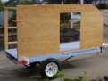 trailer with clamped on side and back frame