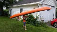 Nick carrying his kayak