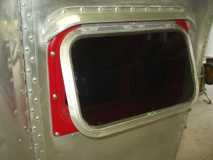 side crank out windows with red trim...I like them.